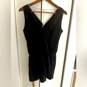 MK romper with a sexy chain